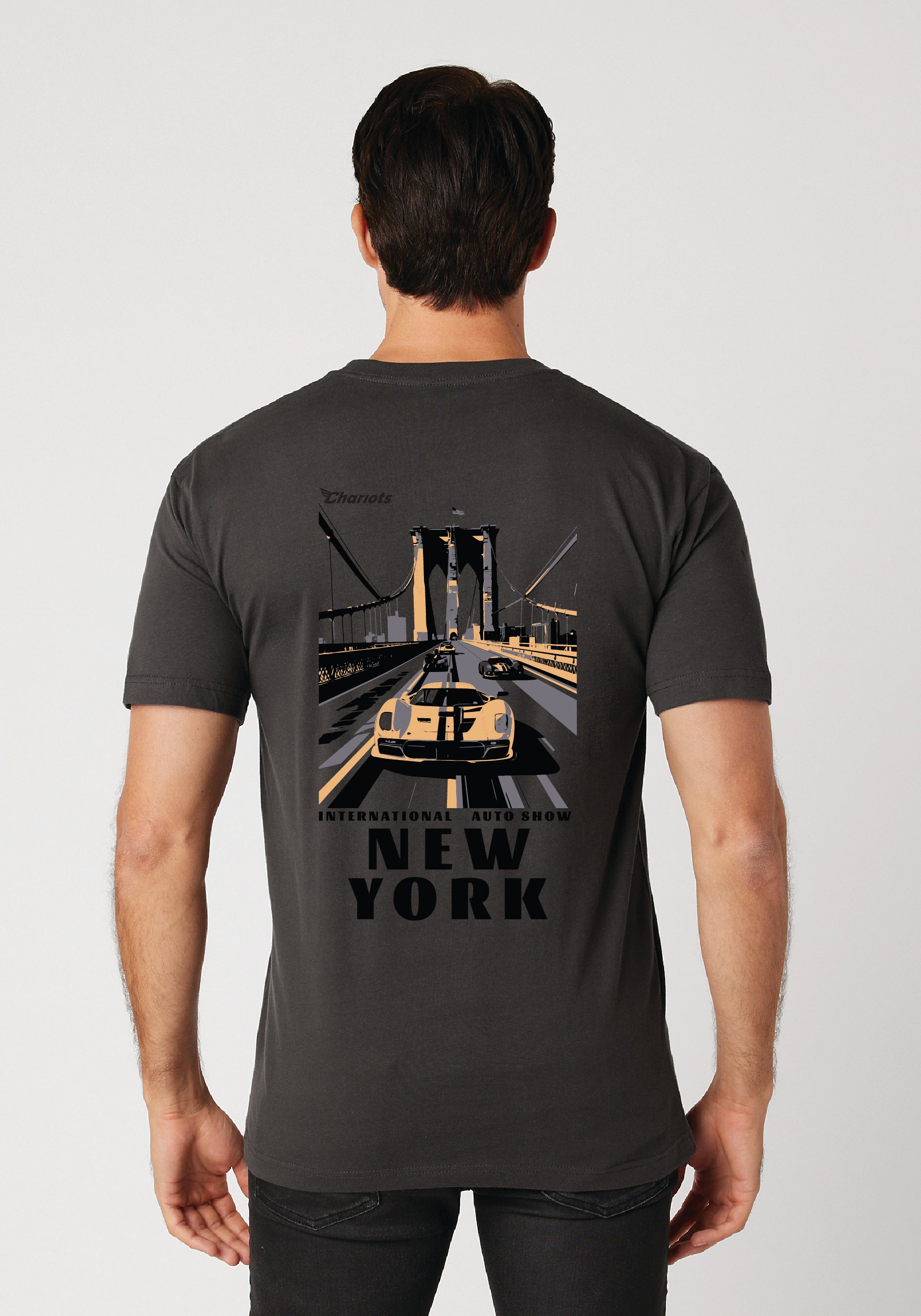 Person wearing a black t-shirt with 'New York' graphic on the back against a white background