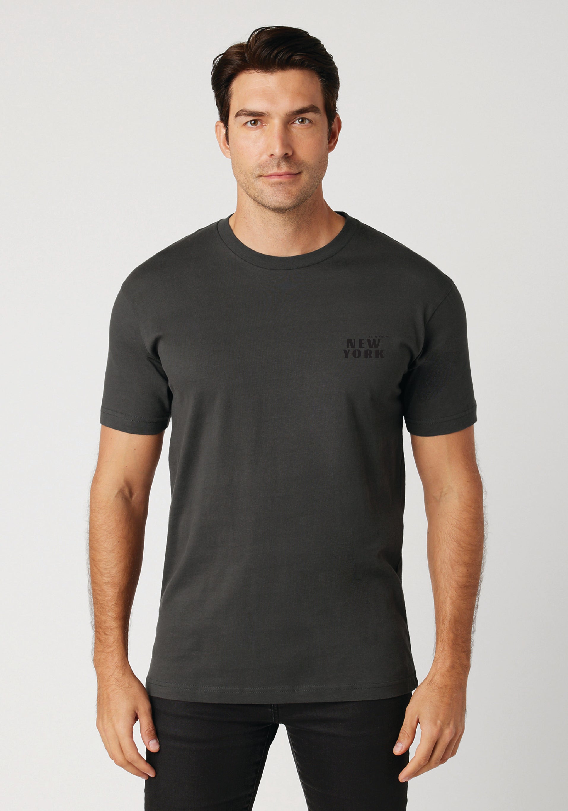Man wearing a black t-shirt with 'New York' text on a white background