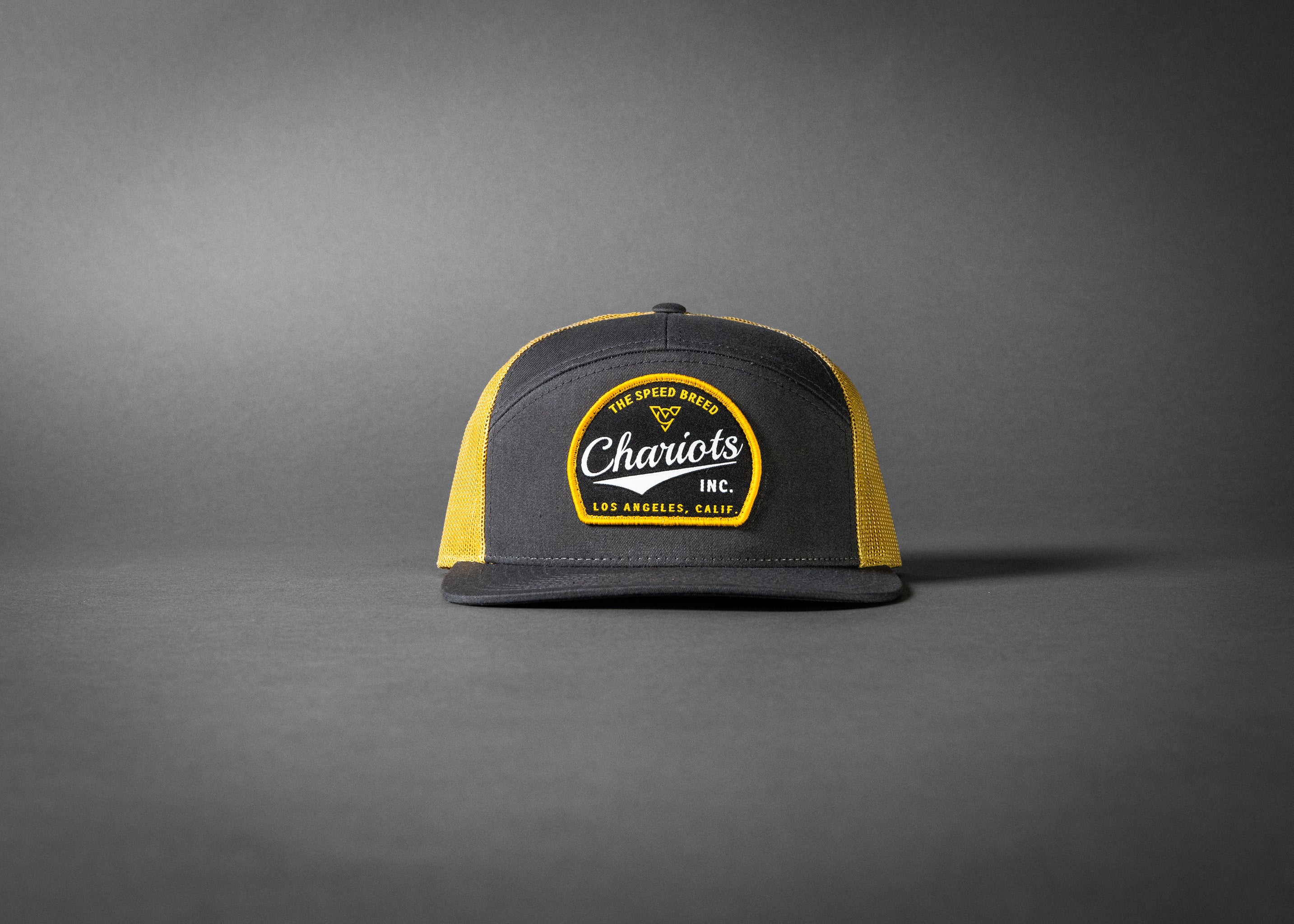 YELLOWJACKET (Charcoal/Old Gold Premium 7-Panel Trucker Hat)