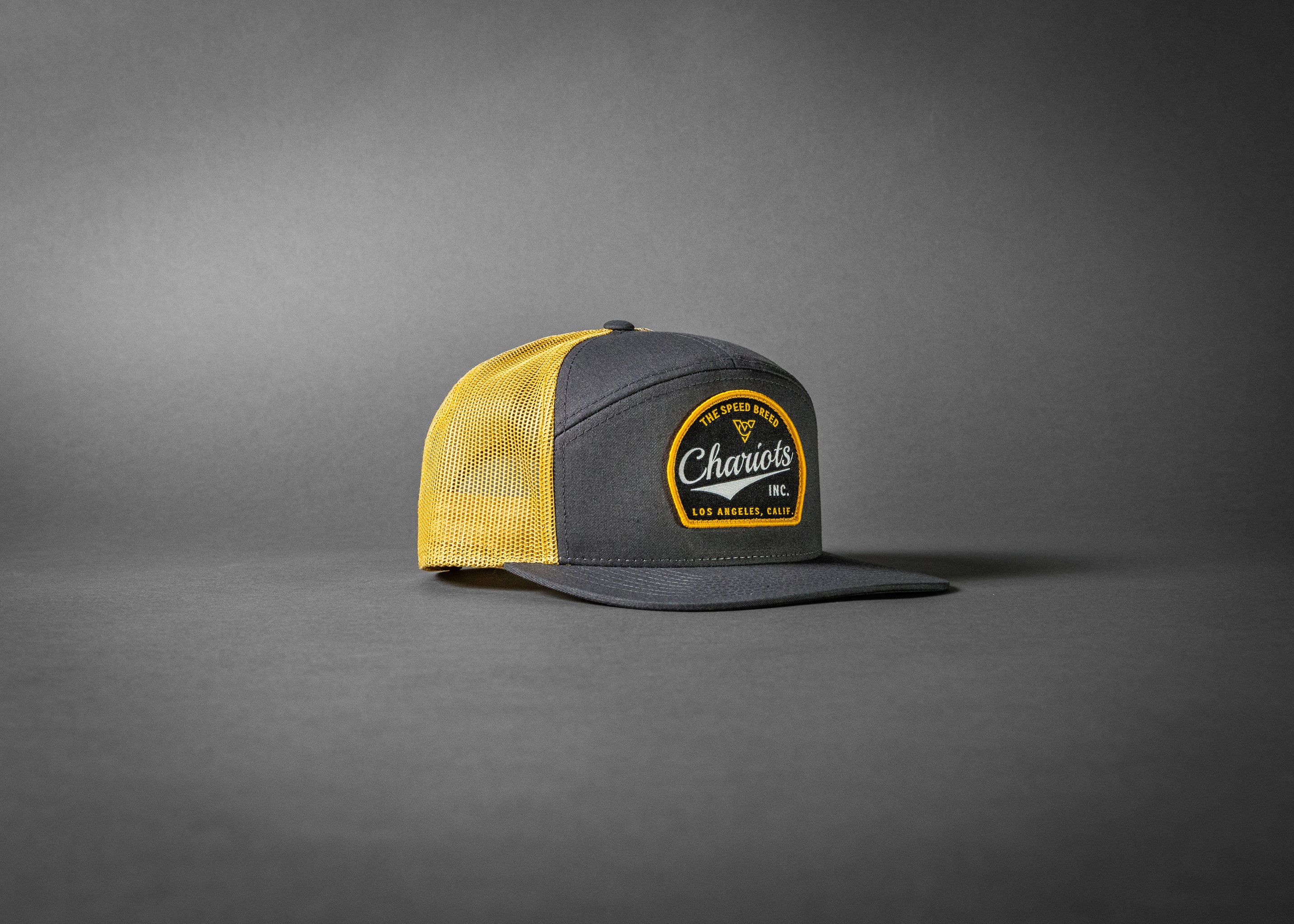 YELLOWJACKET (Charcoal/Old Gold Premium 7-Panel Trucker Hat)