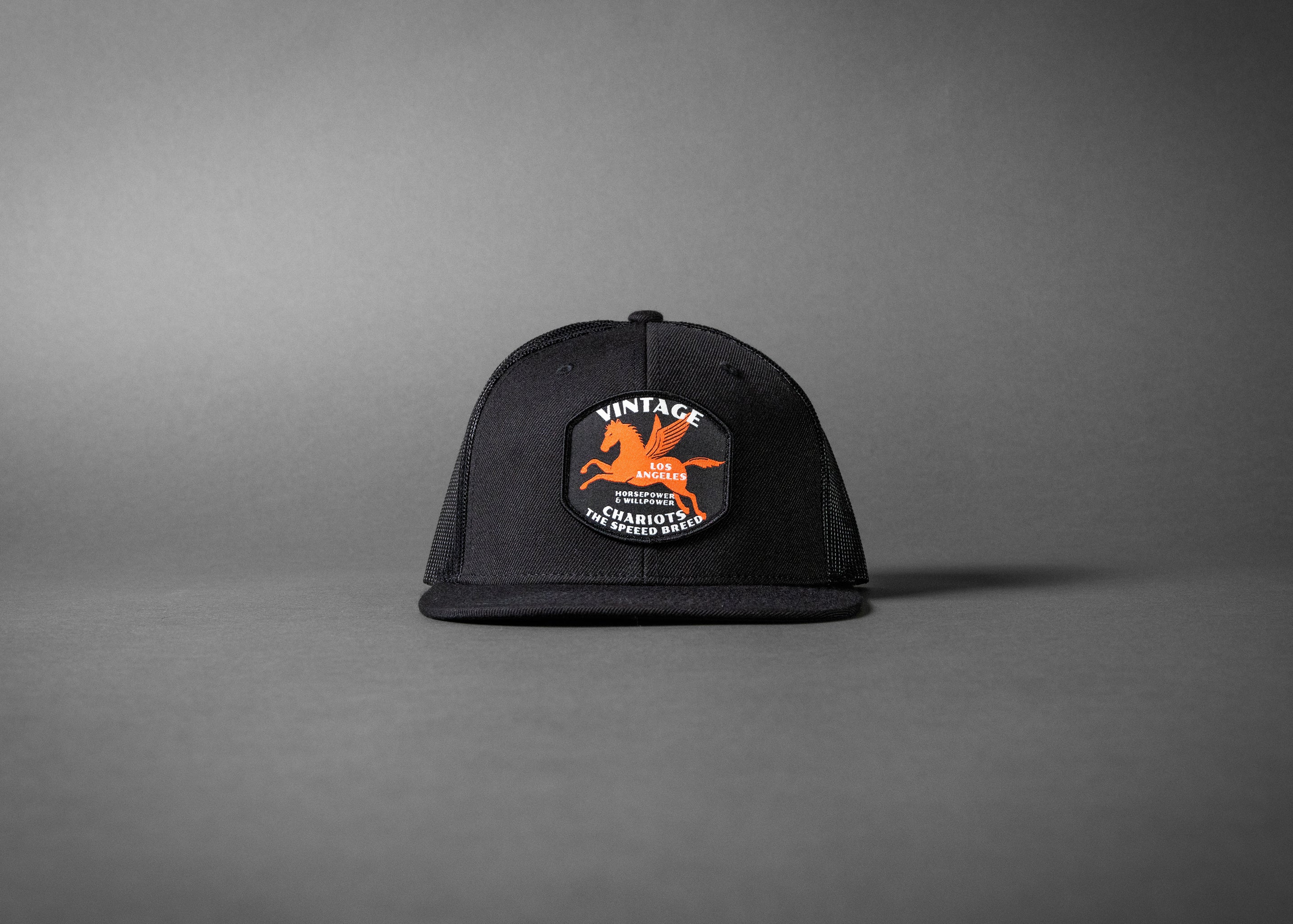 PEGASUS (Black Wool/Black Mesh Flat Bill Trucker Hat)