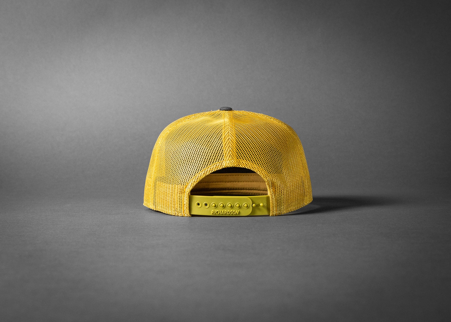PARTY OF ONE (Charcoal/Old Gold Premium 7-Panel Trucker Hat)