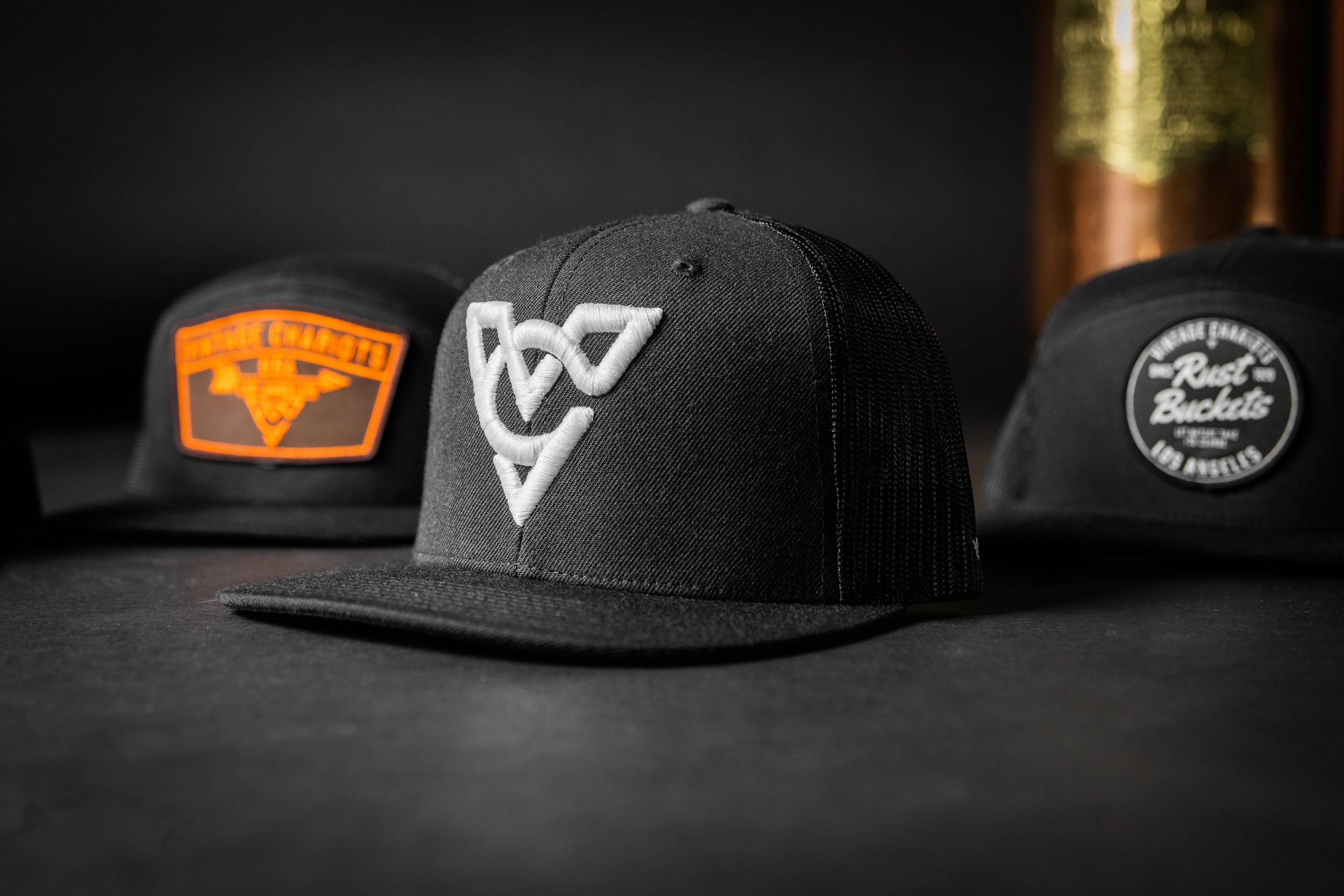 VC WOOL BLEND FLATBILL TRUCKER HAT (Black/Black/White Puff)