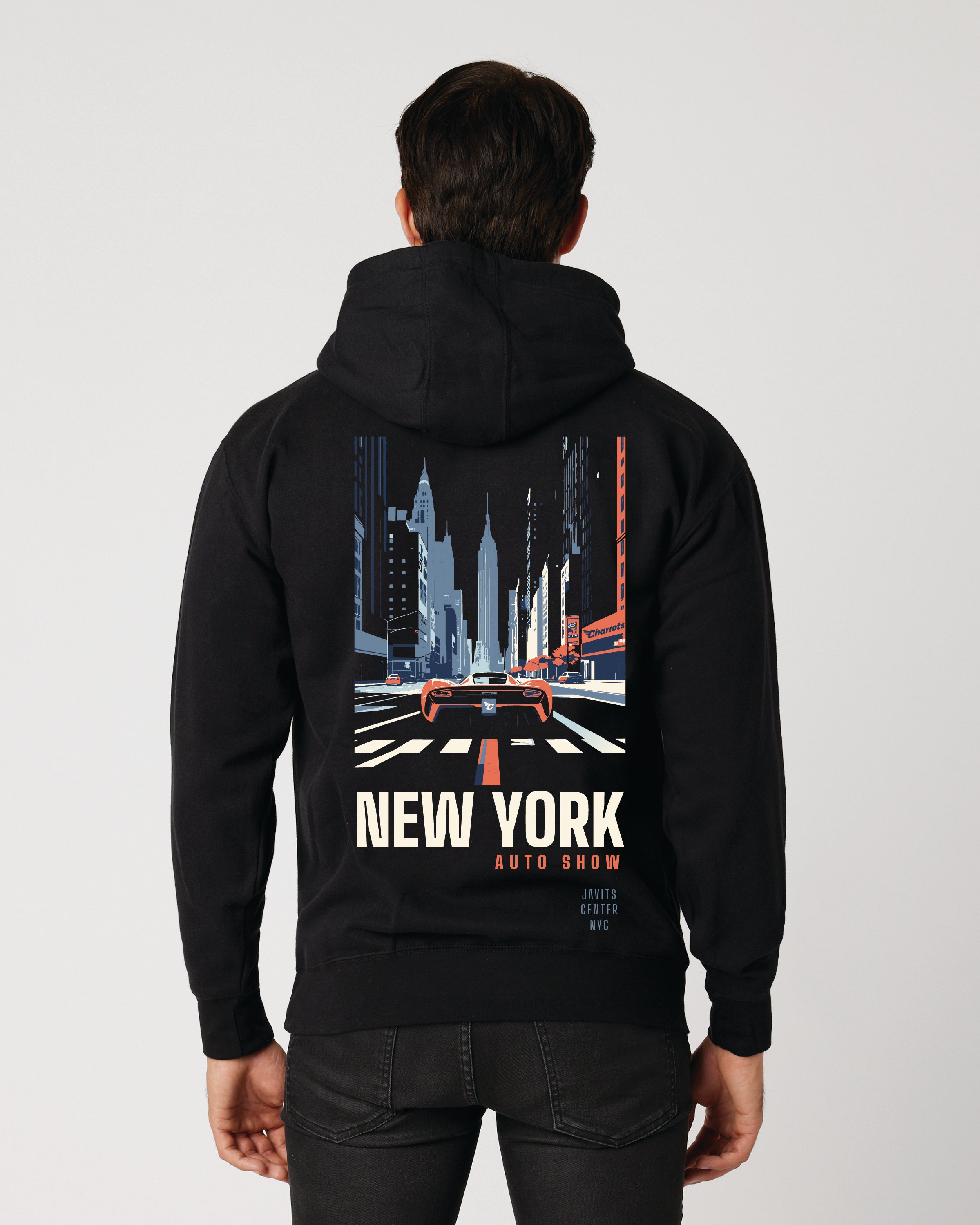 Person wearing a black hoodie with a 'New York Auto Show' design on the back against a white background