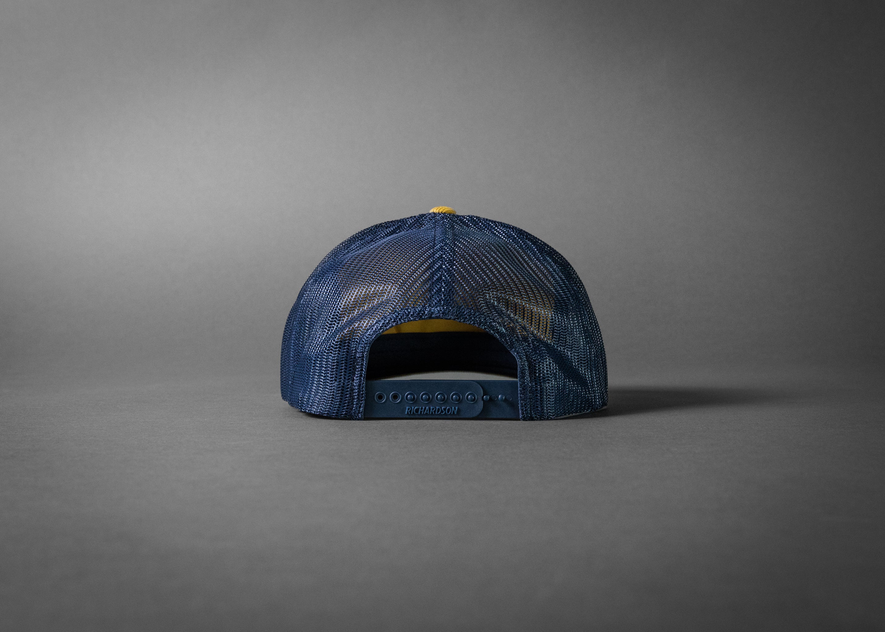 YELLOWJACKET (Amber Gold/Navy Corduroy Trucker Hat)