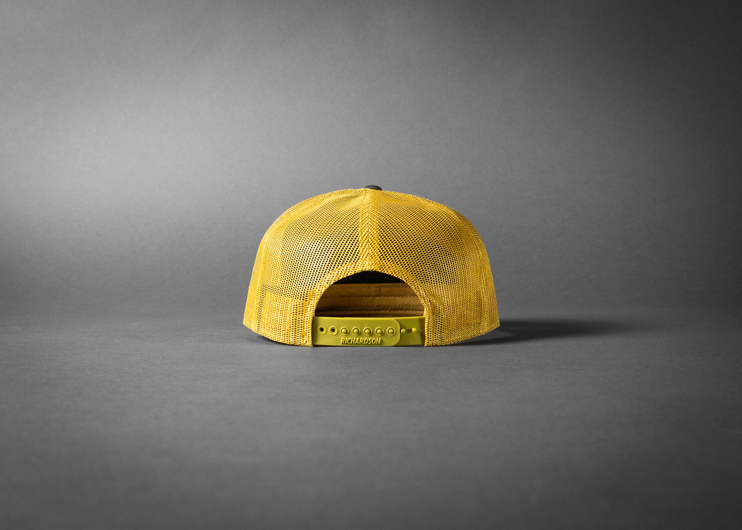 YELLOWJACKET (Charcoal/Old Gold Premium 7-Panel Trucker Hat)